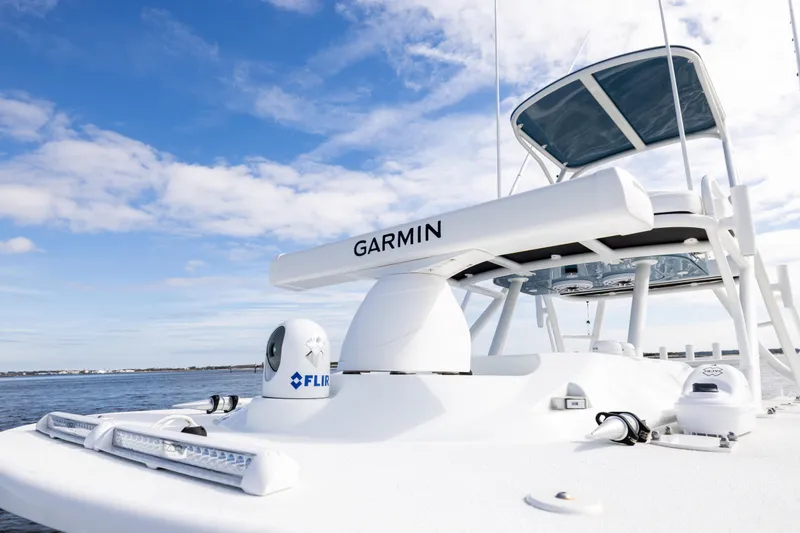 Slide: The Image of 2024 Yellowfin 42 Offshore boat with Garmin and FLIR technology on open water. - 54