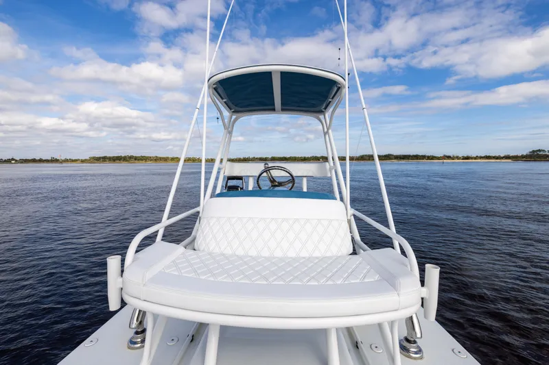 Slide: The Image of 2024 Yellowfin 42 Offshore boat on calm water under blue sky. - 61