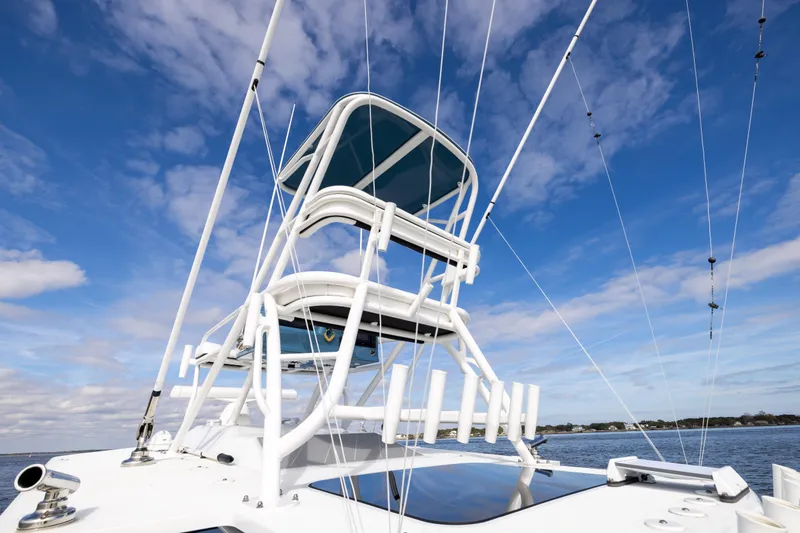 Slide: The Image of 2024 Yellowfin 42 Offshore boat with tower against blue sky. - 65
