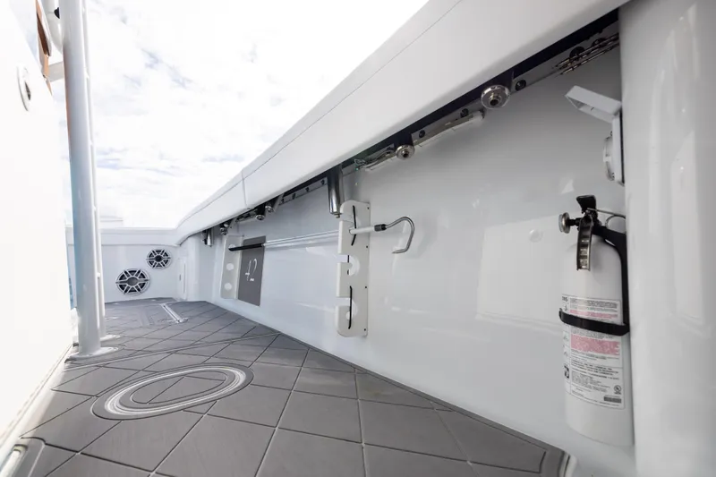 Slide: The Image of 2024 Yellowfin 42 Offshore boat interior with fire extinguisher and speakers. - 73