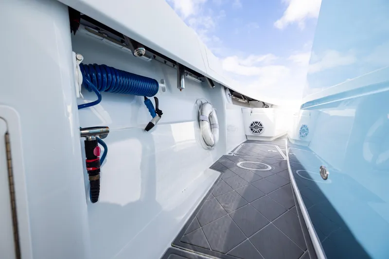 Slide: The Image of 2024 Yellowfin 42 Offshore boat deck with modern features and blue accents. - 75