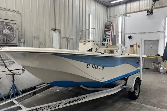 The Image of 2021 Carolina Skiff 17 LS boat on trailer in a garage setting. - 0