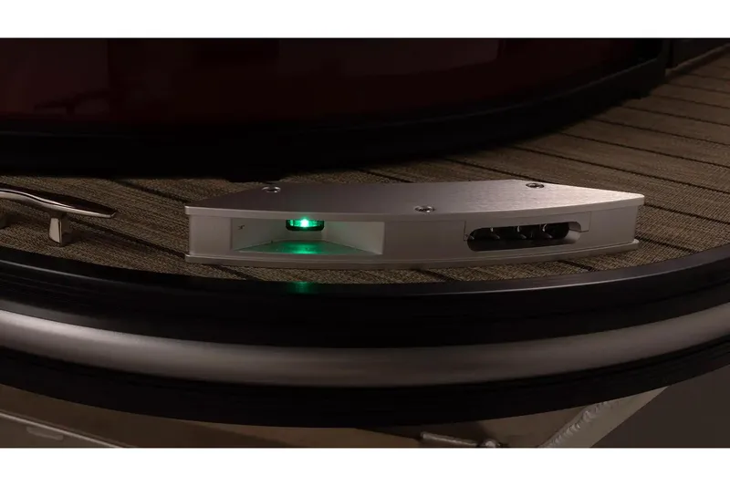 Slide: The Image of 2026 SunCatcher Elite 322 SR boat detail with illuminated green light on deck. - 9