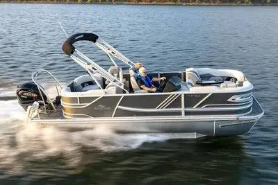 The Image of SunCatcher Elite 322 SR 2026 pontoon boat on the water. - 1