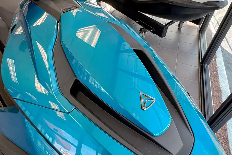 Slide: The Image of 2025 Taiga Orca P2 electric watercraft in showroom, featuring sleek blue design. - 7