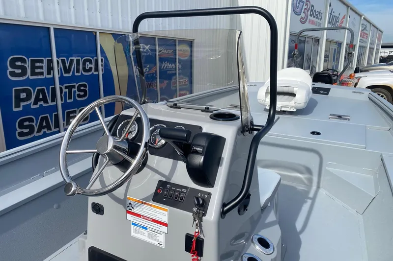 Slide: The Image of 2026 G3 Bay 20 boat interior with steering wheel and control panel. - 8