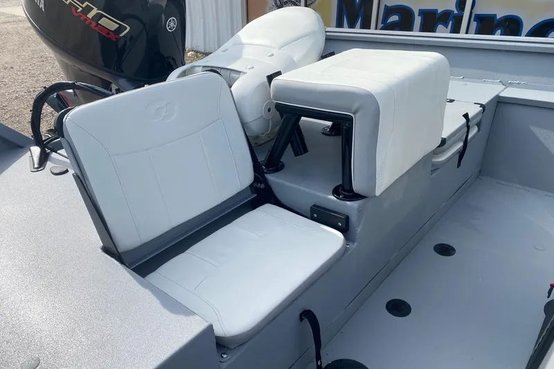 Slide: The Image of 2026 G3 Bay 20 boat interior with white cushioned seats and Yamaha engine. - 9