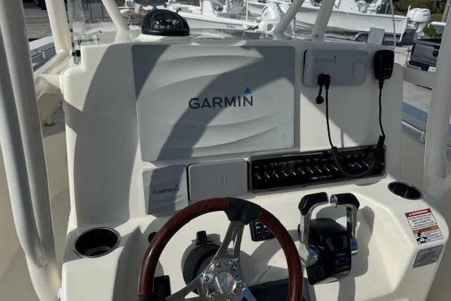Slide: The Image of 2016 Cobia 277 Center Console boat dashboard with Garmin navigation system. - 8