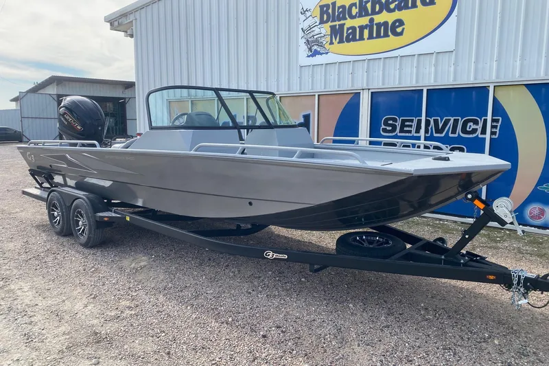 Slide: The Image of 2026 G3 Sportsman 2400 boat on trailer at Blackbeard Marine dealership. - 2