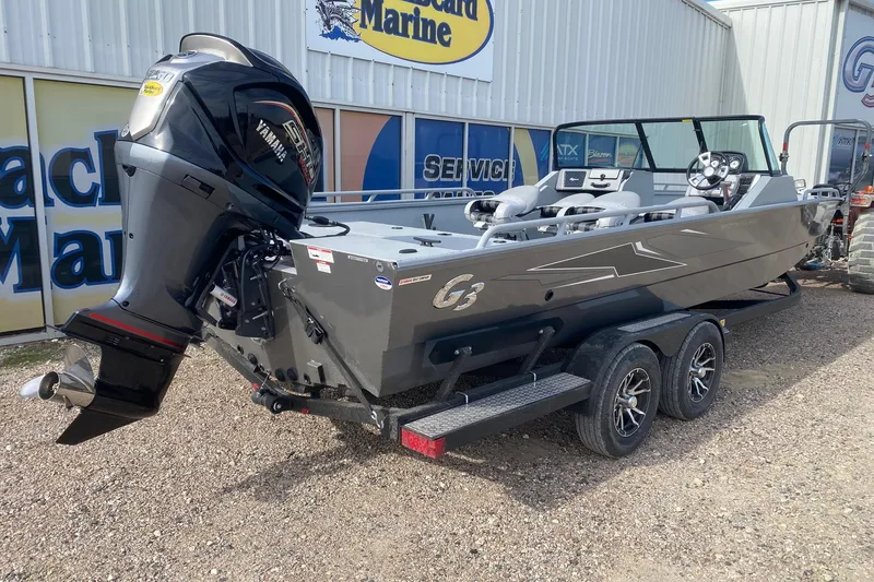 Slide: The Image of 2026 G3 Sportsman 2400 boat with Yamaha outboard motor on trailer, parked outside dealership. - 6