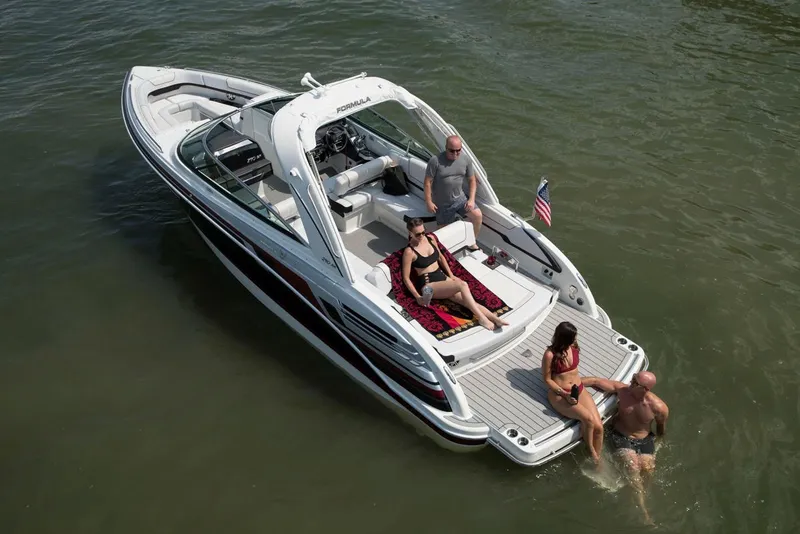 Slide: The Image of Manufacturer Provided Image: 2021 Formula 290 Bowrider boat with people relaxing on deck in the water. - 3