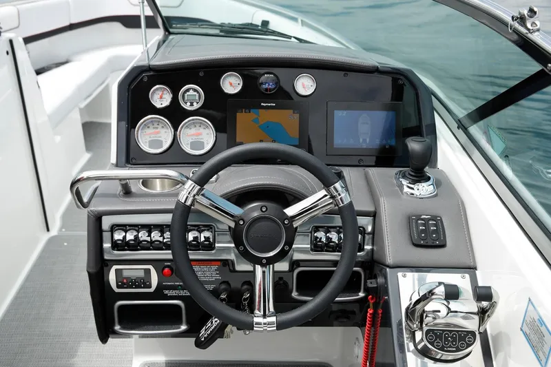 Slide: The Image of Manufacturer Provided Image: 2021 Formula 290 Bowrider dashboard with steering wheel, gauges, and navigation screens. - 11