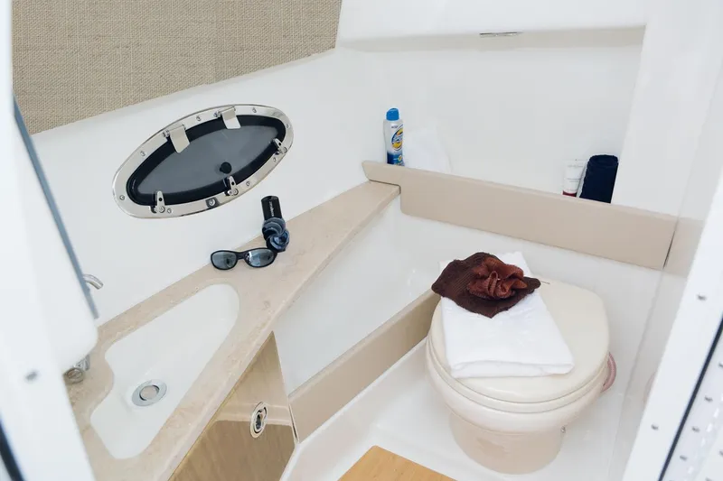 Slide: The Image of Manufacturer Provided Image: 2021 Formula 290 Bowrider bathroom with sink, toilet, and accessories. - 13