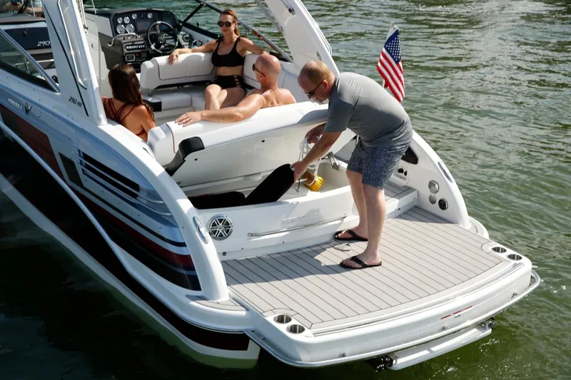Slide: The Image of Manufacturer Provided Image: 2021 Formula 290 Bowrider with people relaxing on the boat in the water. - 4