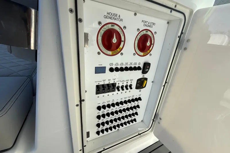 Slide: The Image of Electrical control panel on 2023 Pursuit DC 326 Dual Console boat. - 26