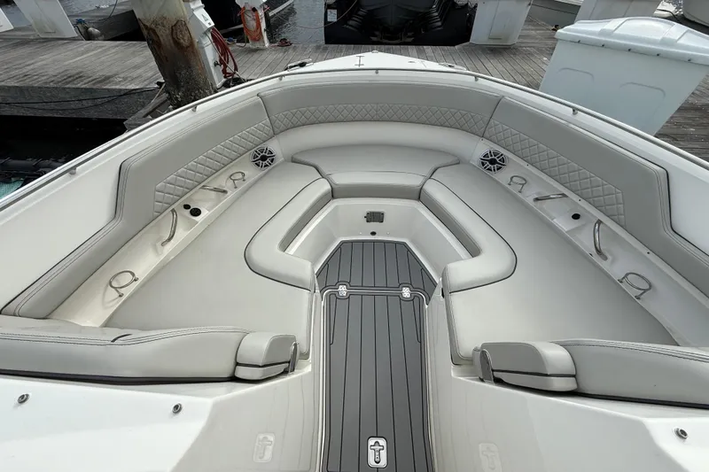 Slide: The Image of 2023 Pursuit DC 326 Dual Console boat interior with luxurious seating and modern design. - 30