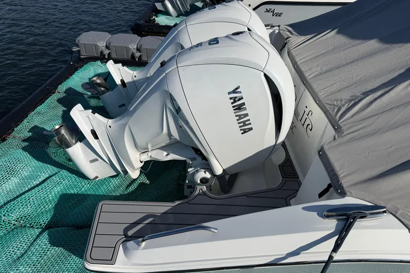 Slide: The Image of 2023 Pursuit DC 326 Dual Console with Yamaha outboard engines, docked and covered. - 32