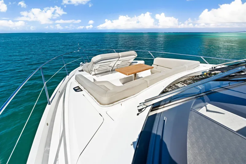 Slide: The Image of Luxurious 2019 Sunseeker Manhattan 66 yacht on serene blue ocean waters. - 11