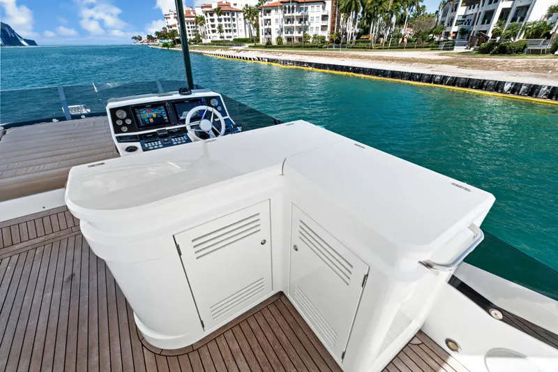 Slide: The Image of 2019 Sunseeker Manhattan 66 yacht helm with ocean view and luxurious deck. - 14