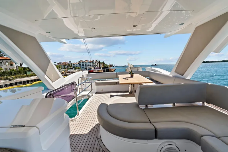 Slide: The Image of Luxurious 2019 Sunseeker Manhattan 66 yacht deck with elegant seating and ocean view. - 17