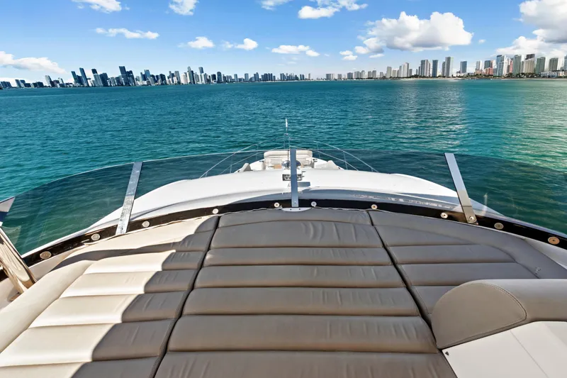 Slide: The Image of Sunseeker Manhattan 66 yacht, 2019 model, cruising with city skyline view. - 19
