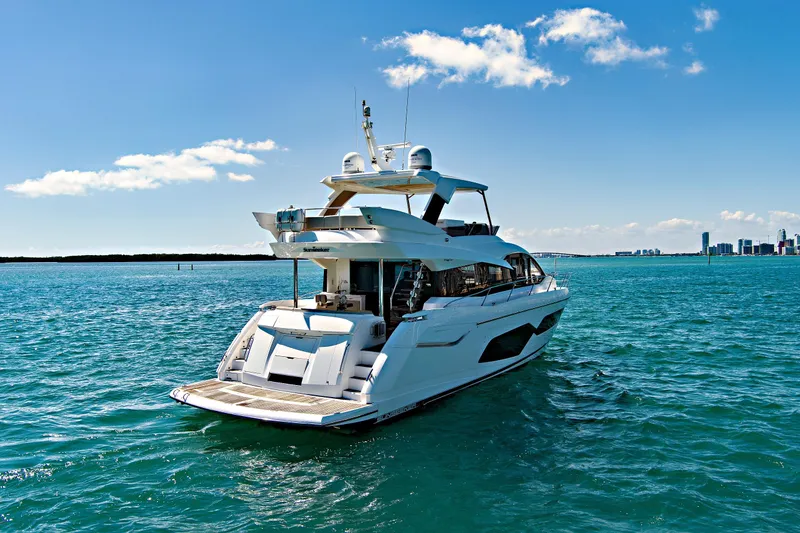 Slide: The Image of Luxurious 2019 Sunseeker Manhattan 66 yacht cruising on clear blue waters. - 3