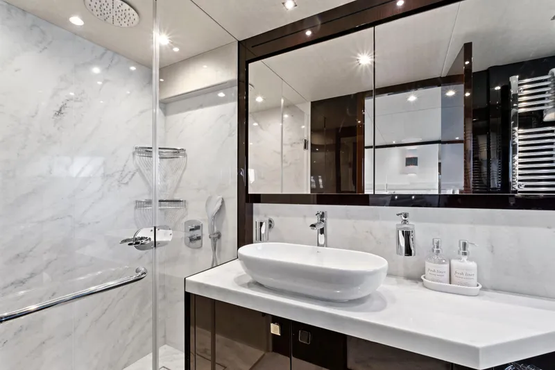 Slide: The Image of Luxurious bathroom in 2019 Sunseeker Manhattan 66 yacht with modern fixtures and marble accents. - 40