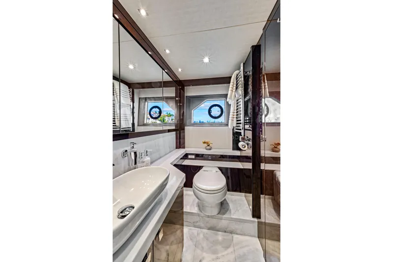 Slide: The Image of Luxurious bathroom in 2019 Sunseeker Manhattan 66 yacht with modern fixtures and porthole window. - 42