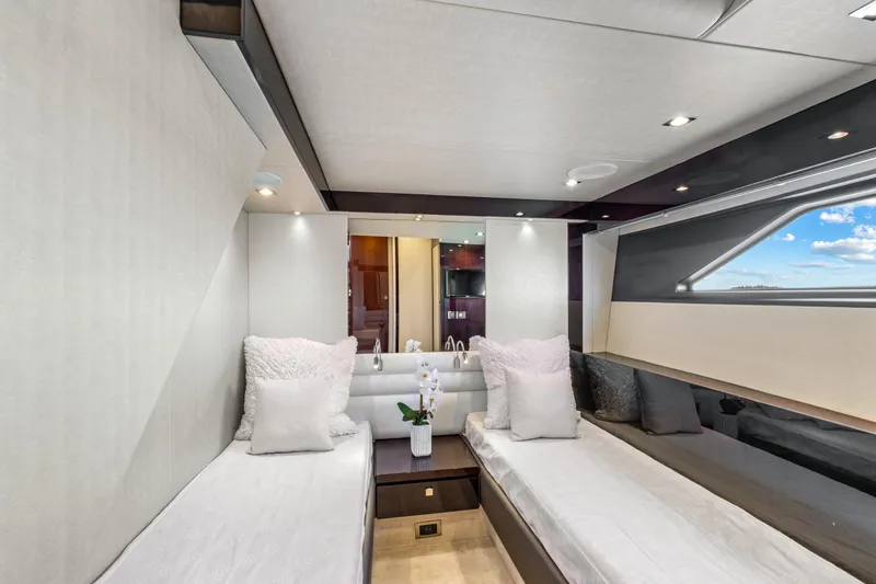 Slide: The Image of Luxurious 2019 Sunseeker Manhattan 66 yacht cabin with twin beds and modern decor. - 43