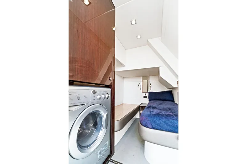 Slide: The Image of 2019 Sunseeker Manhattan 66 yacht interior with washer and cozy bed. - 45