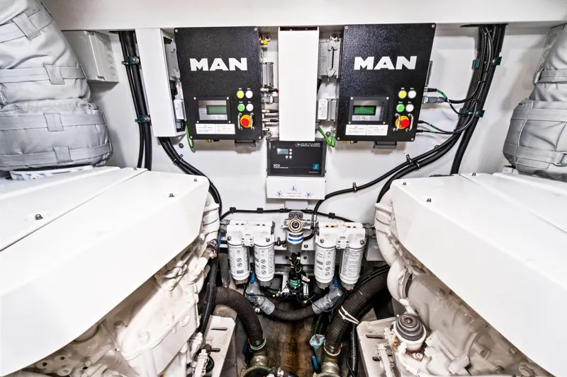 Slide: The Image of Engine room of 2019 Sunseeker Manhattan 66 yacht with MAN engines and control systems. - 46