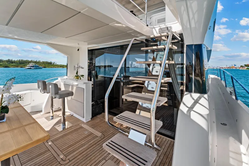 Slide: The Image of Luxurious 2019 Sunseeker Manhattan 66 yacht interior with elegant seating and ocean view. - 9