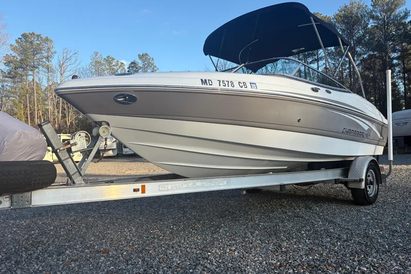 The Image of 2007 Chaparral 190 SSi boat on trailer, parked outdoors with trees in background. - 0