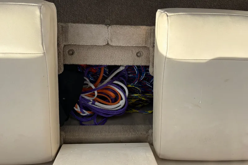 Slide: The Image of Storage compartment in a 2007 Chaparral 190 SSi boat with colorful ropes. - 11