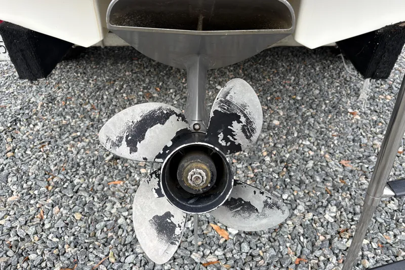 Slide: The Image of Worn propeller of a 2007 Chaparral 190 SSi boat on gravel surface. - 8