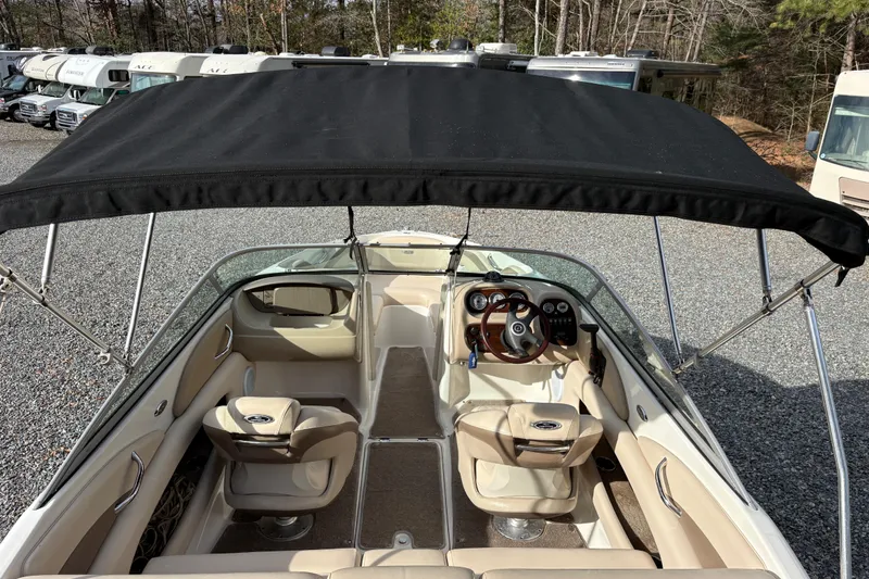 Slide: The Image of 2007 Chaparral 190 SSi boat interior with canopy, steering wheel, and seating. - 9