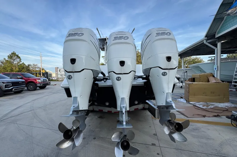 Slide: The Image of 2019 Yellowfin 34 Offshore boat with triple 350 horsepower engines. - 13