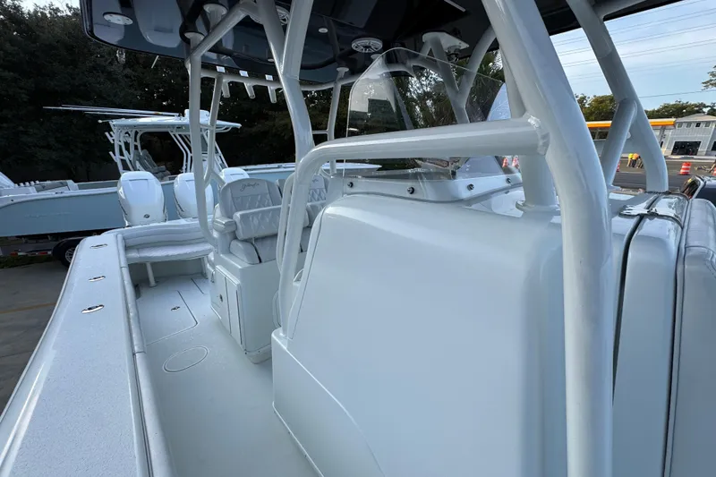 Slide: The Image of 2019 Yellowfin 34 Offshore boat interior with seating and console, showcasing sleek design. - 24