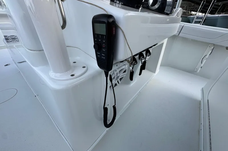 Slide: The Image of 2019 Yellowfin 34 Offshore boat interior with radio and control panel. - 30
