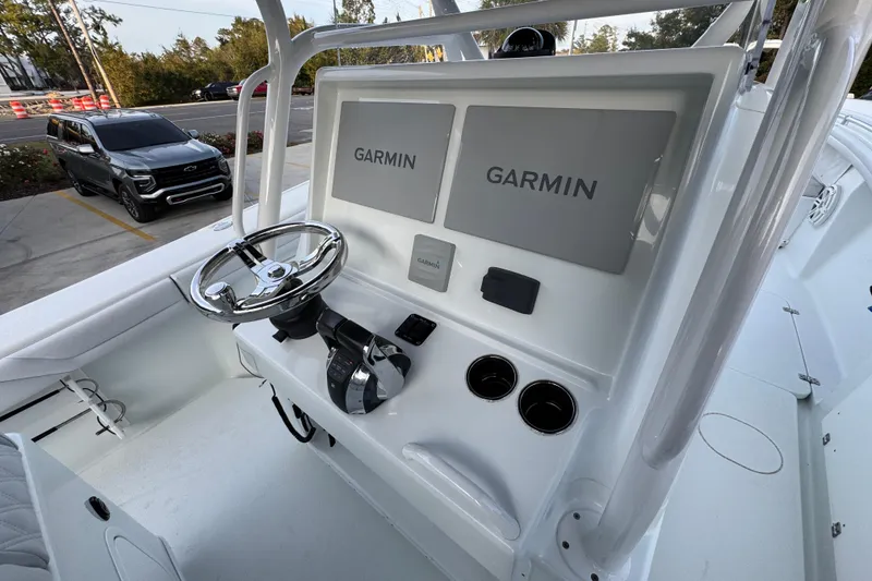 Slide: The Image of 2019 Yellowfin 34 Offshore boat console with Garmin displays and steering wheel. - 32