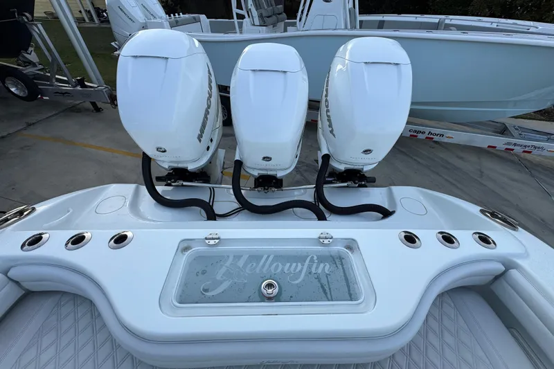 Slide: The Image of 2019 Yellowfin 34 Offshore boat with triple Mercury outboard engines. - 39