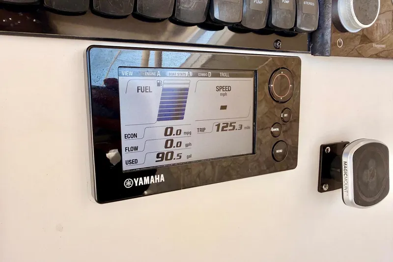 Slide: The Image of Yamaha display on 2016 Sailfish 290 CC showing fuel and trip data. - 23