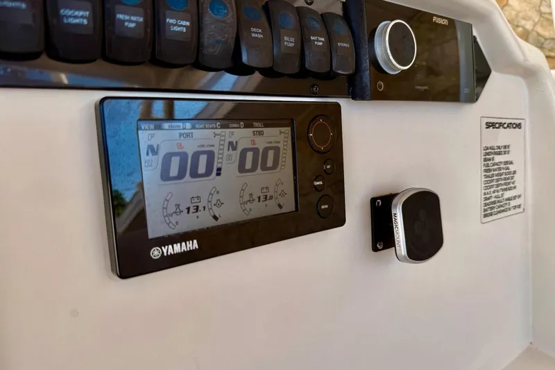 Slide: The Image of Control panel of 2016 Sailfish 290 CC boat with Yamaha display and switches. - 24