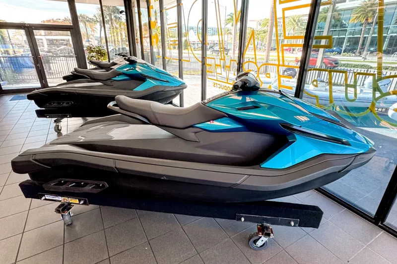 Slide: The Image of 2025 Taiga Orca P2 jet skis displayed in a showroom. - 0