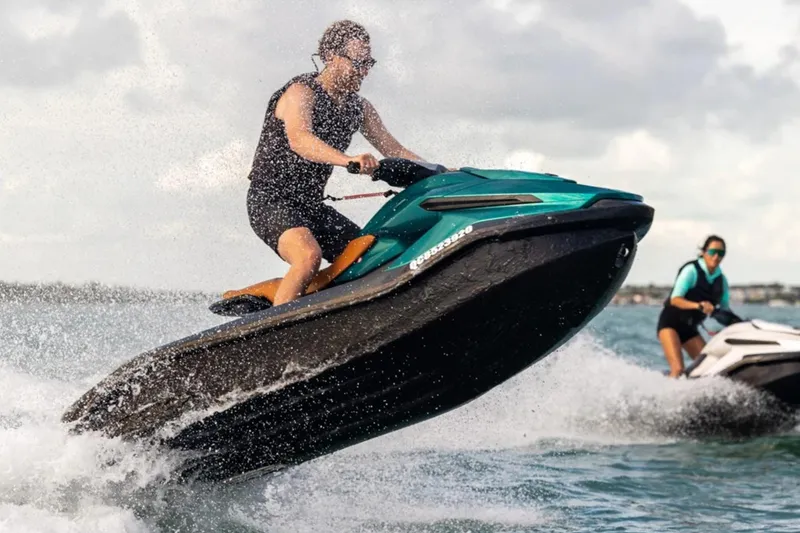 Slide: The Image of Person riding 2025 Taiga Orca P2 jet ski on water. - 1