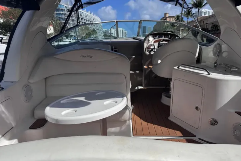 Slide: The Image of Interior of a 2005 Sea Ray 280 Sundancer boat with seating and helm. - 11