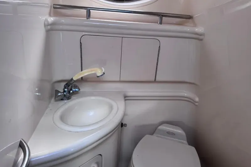 Slide: The Image of 2005 Sea Ray 280 Sundancer bathroom with sink and toilet. - 16