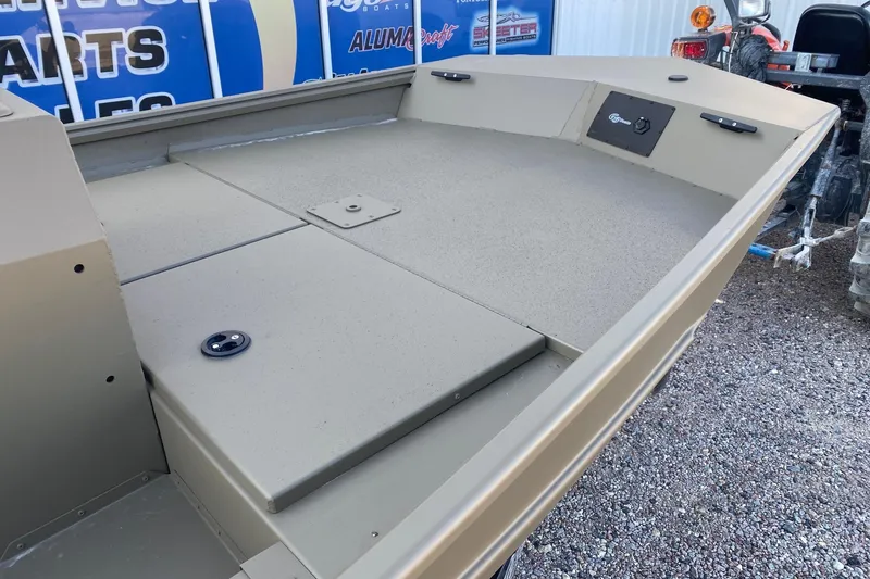 Slide: The Image of 2026 G3 Gator Tough 17 CCJ boat deck, beige finish, outdoor display. - 7