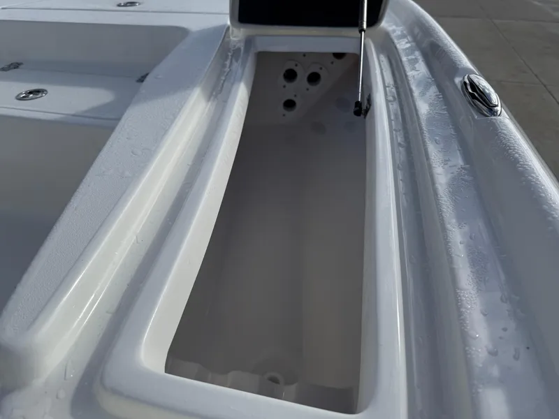 Slide: The Image of 2025 Key West 210 Bay Reef boat storage compartment, open and empty. - 14