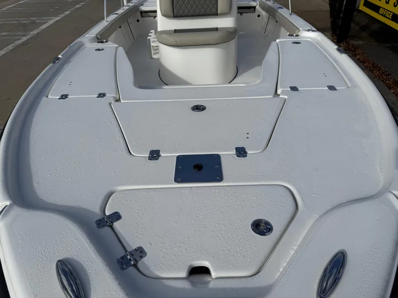 Slide: The Image of 2025 Key West 210 Bay Reef boat deck with seating and storage compartments. - 21